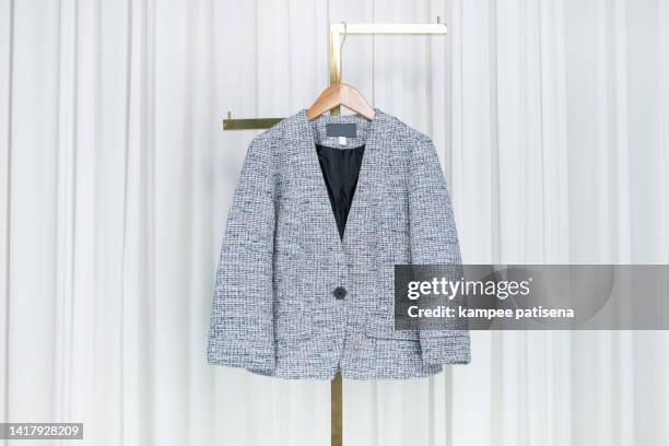 grey blazer hanging in home - blazer jacket bildbanksfoton och bilder