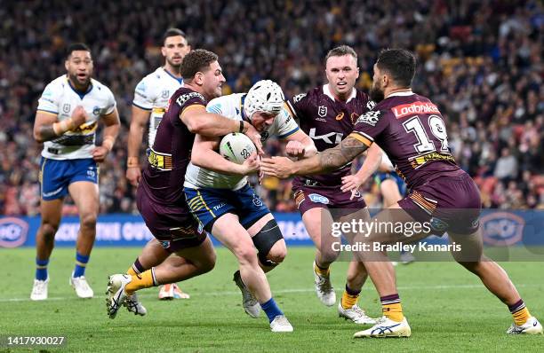 Reed Mahoney of the Eels takes on the defence during the round 24 NRL match between the Brisbane Broncos and the Parramatta Eels at Suncorp Stadium,...