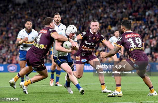 Reed Mahoney of the Eels takes on the defence during the round 24 NRL match between the Brisbane Broncos and the Parramatta Eels at Suncorp Stadium,...