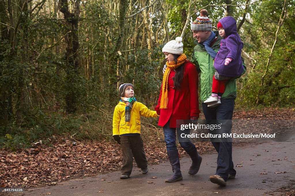 Family walking together on rural road