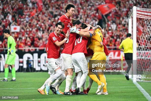 Urawa Red Diamonds players celebrate their victory through the penalty shootout following the AFC Champions League semi final between Jeonbuk Hyundai...