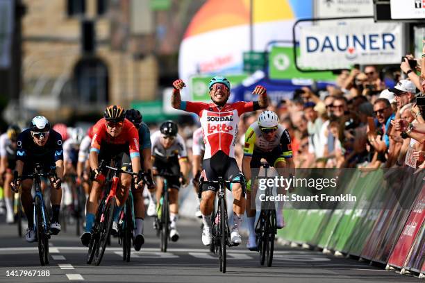 Caleb Ewan of Australia and Team Lotto Soudal celebrates at finish line as stage winner ahead of Jonathan Milan of Italy and Team Bahrain Victorious,...