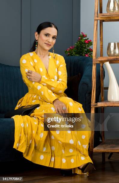 portrait of beautiful woman smiling - yellow dress stock pictures, royalty-free photos & images