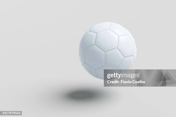 soccer ball about to bounce on the ground - ball photos et images de collection