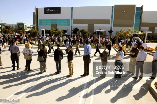 Job seekers seeking employment lined up for high-technology jobs outside Virgin Galactic's newest facility, March 7, 2015 in Long Beach, California.