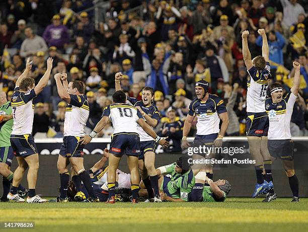 Brumbies players celebrate after winning the round five Super Rugby match between the Brumbies and the Highlanders at Canberra Stadium on March 24,...