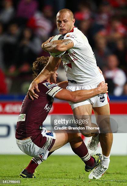 Matt Cooper of the Dragons is tackled by Daly Cherry-Evans of the Sea Eagles during the round four NRL match between the St George Illawarra Dragons...