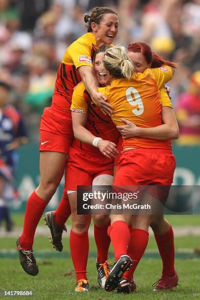 Rachael Burford of England is congratulated by team mates after defeating Australia during the Women's Seven's Challenge Cup Final match between...