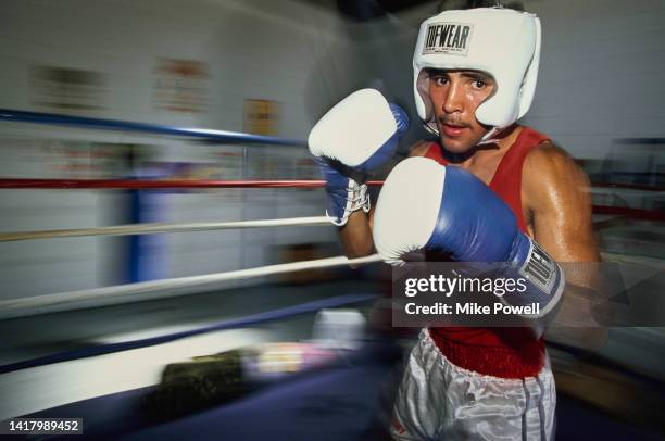 Boxer Oscar De La Hoya of the United States poses for photograph during a training session on 1st June 1991 at the Resurrection Gym in Boyle Heights,...