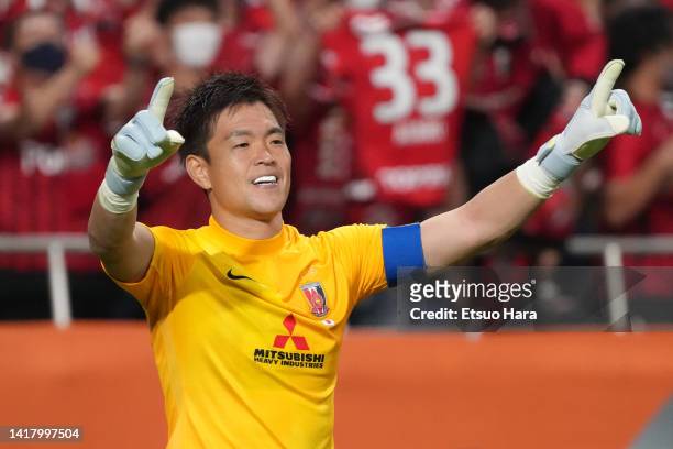 Shusaku Nishikawa of Urawa Red Diamonds celebrates the victory at the end of the penalty shoot out in the AFC Champions League semi final between...