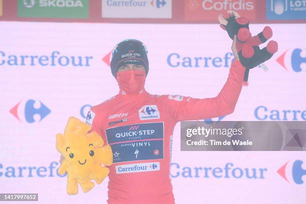 Remco Evenepoel of Belgium and Team Quick-Step - Alpha Vinyl celebrates winning the Red Leader Jersey on the podium ceremony after the 77th Tour of...