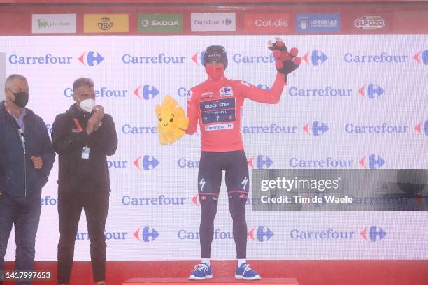 Remco Evenepoel of Belgium and Team Quick-Step - Alpha Vinyl celebrates winning the Red Leader Jersey on the podium ceremony after the 77th Tour of...