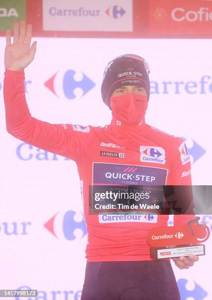 Remco Evenepoel of Belgium and Team Quick-Step - Alpha Vinyl celebrates winning the Red Leader Jersey on the podium ceremony after the 77th Tour of...