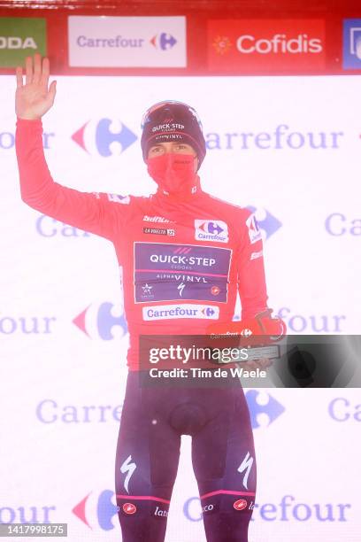 Remco Evenepoel of Belgium and Team Quick-Step - Alpha Vinyl celebrates winning the Red Leader Jersey on the podium ceremony after the 77th Tour of...