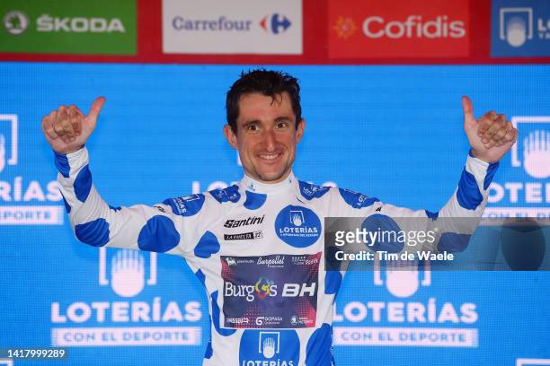 Victor Langellotti of Monaco and Team Burgos - BH celebrates winning the Polka dot mountain jersey on the podium ceremony after the 77th Tour of...