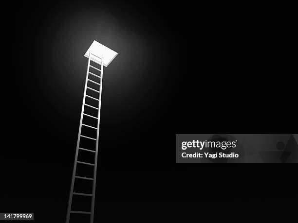 ladder leading to the exit, black background - hole ストックフォトと画像