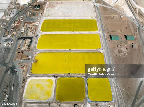 In this aerial view, ponds of brine containing concentrated lithium carbonate stretch through a lithium mine in the salt flats of the Atacama Desert...