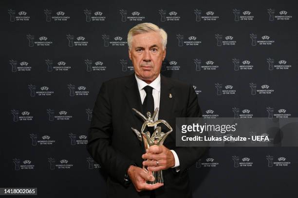 Carlo Ancelotti, Head Coach of Real Madrid CF poses for a photograph with the UEFA Men's Coach of the Year Award after the UEFA Champions League...