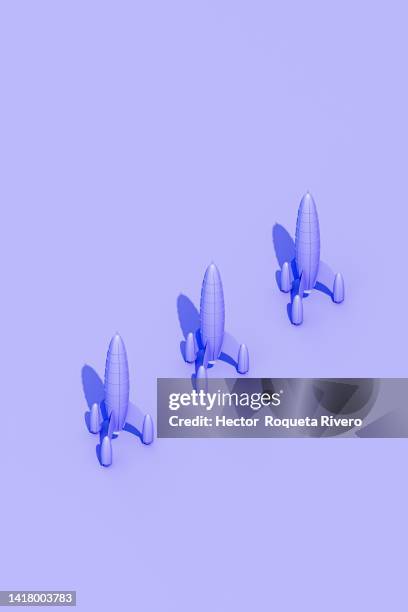 3d illustration of  many purple rocket in purple background - dimensions launch party stock-fotos und bilder