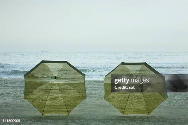 two umbrellas putting in the beach - backdrop projection of beach stock pictures, royalty-free photos & images