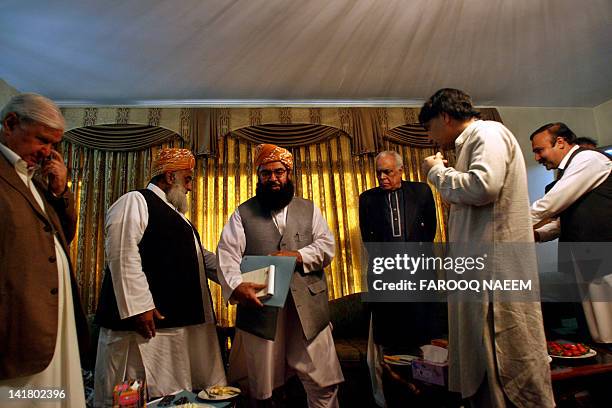 Pakistani opposition leaders Aftab Sherpao , Maulana Fazal-ur-Rehman , Mulana Gafur Hadri , Chaudhry Nisar arrive at a meeting to discuss the...