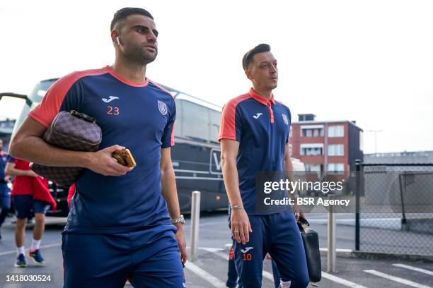 Deniz Turuc of Istanbul Basaksehir and Mesut Ozil of Istanbul Basaksehir arrive prior to the UEFA Conference League Play-Off Second Leg match between...