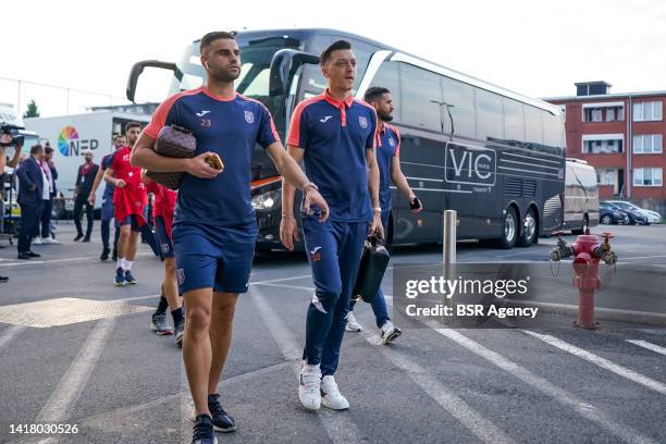 Deniz Turuc of Istanbul Basaksehir and Mesut Ozil of Istanbul Basaksehir arrive prior to the UEFA Conference League Play-Off Second Leg match between...