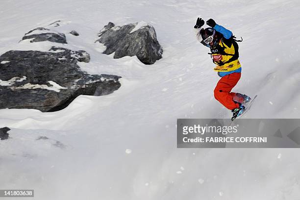 France's Jonathan Charlet competes in the New 2012 Freeride World Champion at the Men's snowboard event on the Bec de Rosses mountain during the...