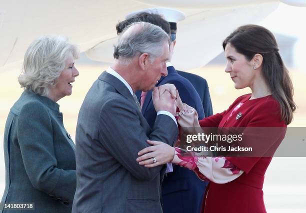 Prince Charles, Prince of Wales kisses Princess Mary of Denmark's hand as he arrives at Copenhagen Kastrup Airport on March 24, 2012 in Copenhagen,...