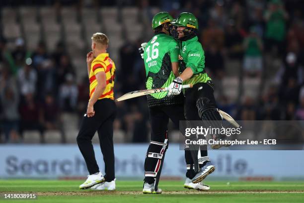 Tim David and Alex Davies of Southern Brave Men celebrate following The Hundred match between Southern Brave Men and Trent Rockets Men at Ageas Bowl...