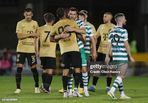 Aaron Greene of Shamrock Rovers and Aissa Laidouni of Ferencvaros embrace after the UEFA Europa League Play Off Second Leg match between Shamrock...