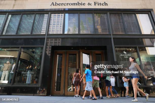 People walk past an Abercrombie & Fitch store on Fifth Avenue on August 25, 2022 in New York City. The Abercrombie retail store, which also owns the...