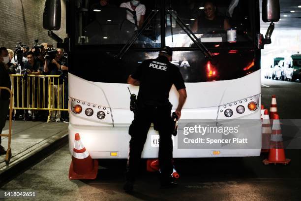 Bus carrying migrants who crossed the border from Mexico into Texas arrives into the Port Authority bus station in Manhattan on August 25, 2022 in...