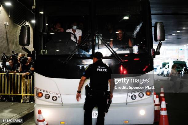 Bus carrying migrants who crossed the border from Mexico into Texas arrives into the Port Authority bus station in Manhattan on August 25, 2022 in...