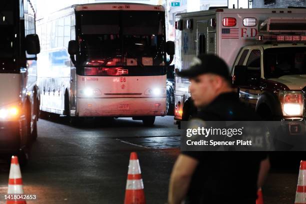 Bus carrying migrants who crossed the border from Mexico into Texas arrives into the Port Authority bus station in Manhattan on August 25, 2022 in...