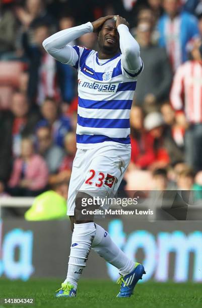 Djibril Cisse of Queens Park Rangers looks on, after he is sent off from the challenge on Fraizer Campbell of Sunderland during the Barclays Premier...