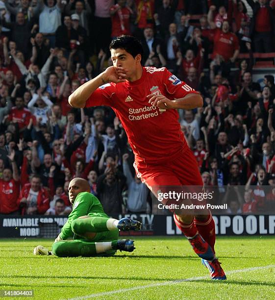 Luis Suarez of Liverpool celebrates his goal during the Barclays Premier League match between Liverpool and Wigan at Anfield on March 24, 2012 in...