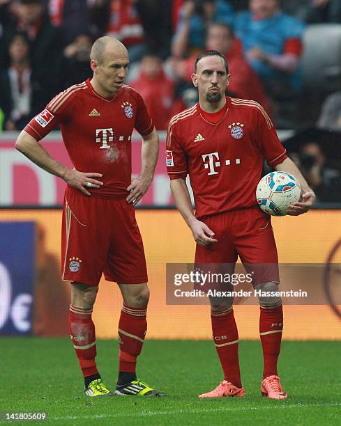 Arjen Robben of Muenchen looks on with his team mate Franck Ribery during the Bundesliga match between FC Bayern Muenchen and Hannover 96 at Allianz...