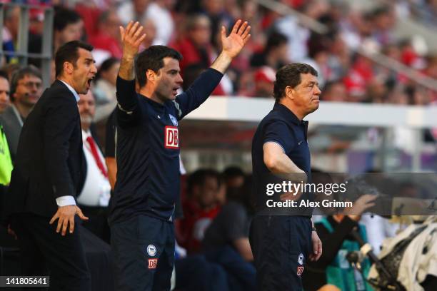 Head coach Otto Rehhagel, assistant coach Rene Tretschok and manager Michael Preetz of Berlin react during the Bundesliga match between FSV Mainz 05...