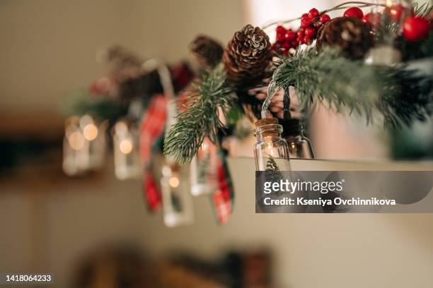 wooden tabletop and christmas decoration on blurred modern kitchen. stay at home. - garland stock pictures, royalty-free photos & images