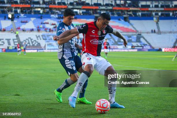 Nicolas Ibañez of Pachuca fights for the ball with Anderson Santamaria of Atlas during the 16th round match between Pachuca and Atlas as part of the...