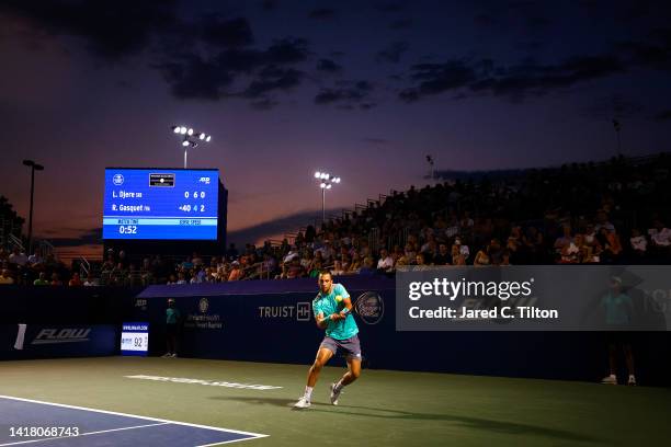 Laslo Djere of Serbia returns a shot from Richard Gasquet of France during their quarterfinals match on day six of the Winston-Salem Open at Wake...