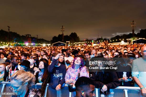 Festival goers wait for a show during All Points East festival at Victoria Park on August 25, 2022 in London, England.