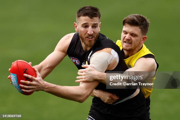 Taylor Duryea tackles Marcus Bontempelli during a Western Bulldogs AFL training session at ETU Stadium on August 26, 2022 in Melbourne, Australia.