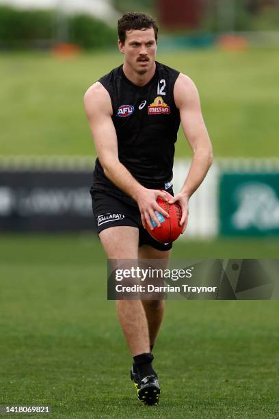 Zaine Cordy runs with the ball during a Western Bulldogs AFL training session at ETU Stadium on August 26, 2022 in Melbourne, Australia.