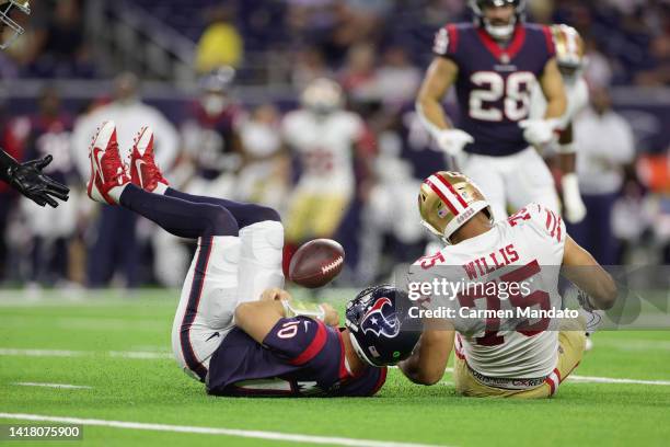 Davis Mills of the Houston Texans is sacked by Jordan Willis of the San Francisco 49ers during the second quarter of a preseason game at NRG Stadium...