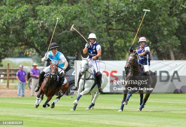 Prince Harry, Duke of Sussex, Louis Devaleix and Juan Bollini play polo during the Sentebale ISPS Handa Polo Cup 2022 on August 25, 2022 in Aspen,...