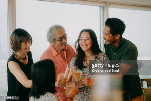 happy family toasting at home - 飲み会　日本 ストックフォトと画像