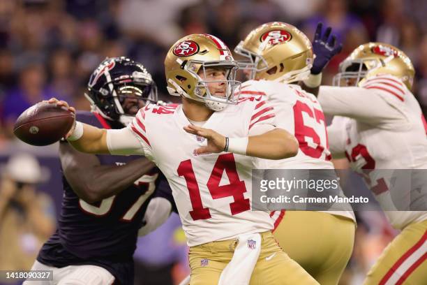 Brock Purdy of the San Francisco 49ers looks to pass during the second half of a preseason game against the Houston Texans at NRG Stadium on August...
