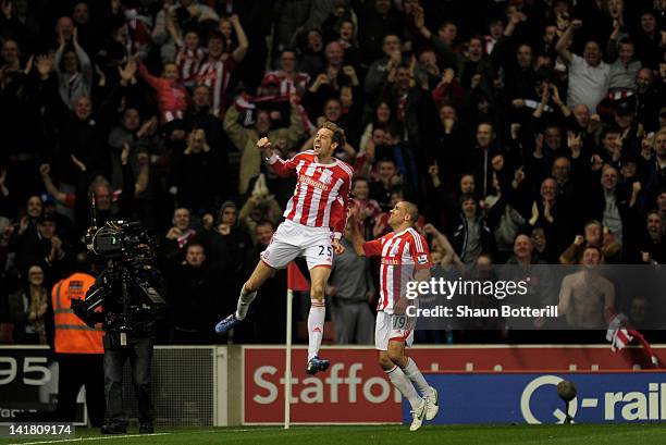 Peter Crouch of Stoke celebrates with teammate Jonathan Walters after scoring the opening goal during the Barclays Premier League match between Stoke...